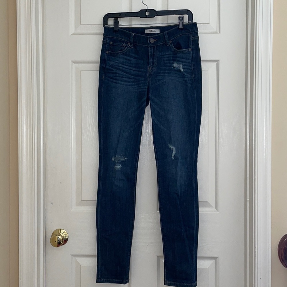 Dark blue skinny jeans with rips